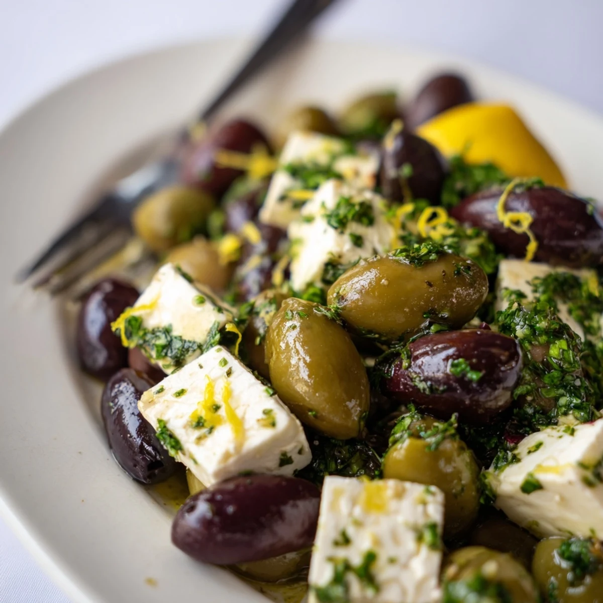 Close-up of a bowl of Holiday Mix of Mixed Olives with Feta featuring the Mediterranean flavors.