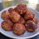Close-up of freshly cooked German Meatballs, sizzling in a skillet, perfect for dinner tonight.