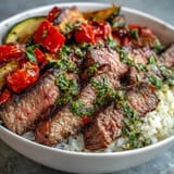 Colorful Grilled Steak Bowl with sizzling steak, fluffy rice, and charred veggies for a hearty meal.