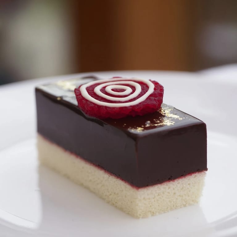 A close-up view of the Golden Ratio Shell dessert, featuring a decadent chocolate mousse swirl.